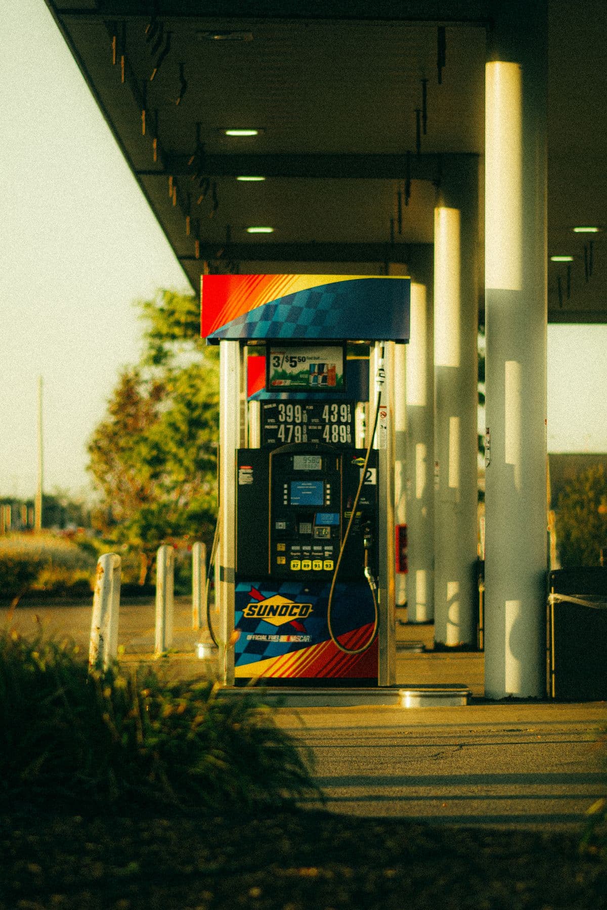 A modern Sunoco fuel pump at golden hour
